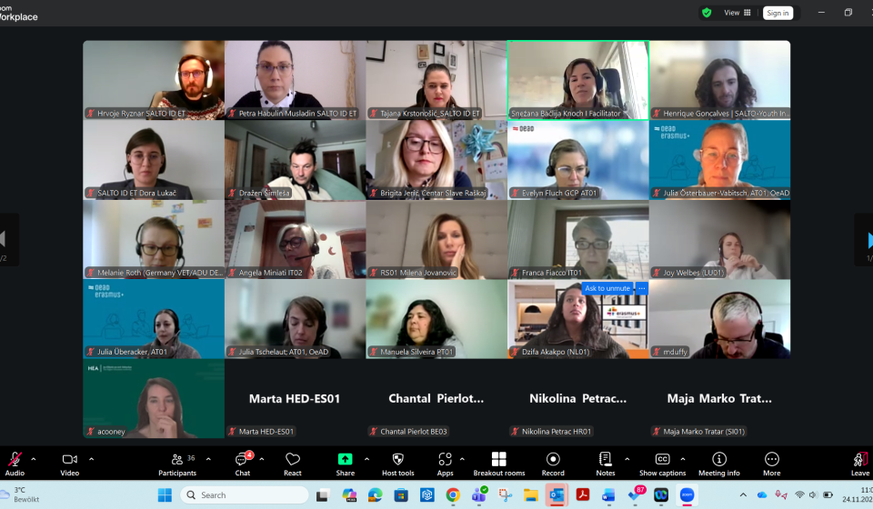 A screenshot with numerous images of participants at an online meeting on Zoom.