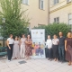 Staff from SALTO ID ET, the Croatian Agency for Mobility and EU Programmes, and the Czech National Agency for International Education and Research pose together outdoors beside a SALTO Inclusion and Diversity banner during a job shadowing visit.