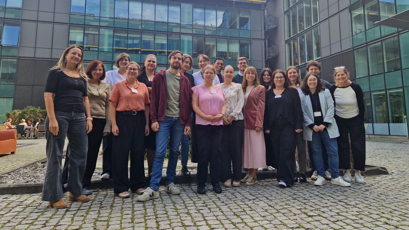 Group photo of participants at the Erasmus+ and European Solidarity Corps Inclusion and Diversity Strategy consultation in Brussels, standing together in the courtyard of the European Commission’s DG EAC premises.